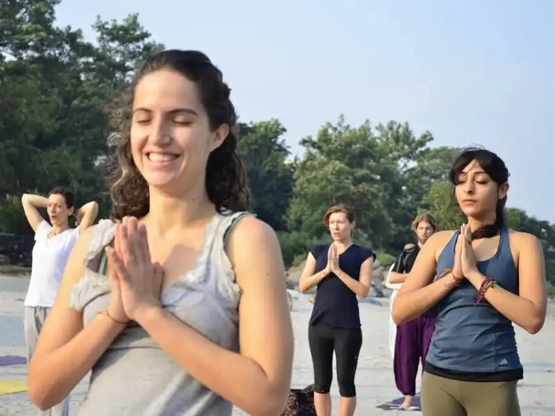 yogis doing surya namaskar practice in group