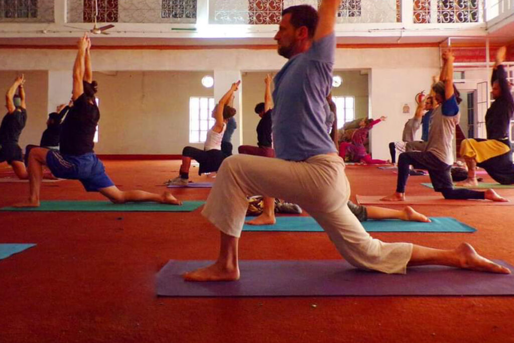 Yogis practicing in yoga hall