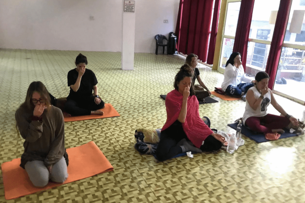 Yogis practicing pranayama at Abhyantara Yoga